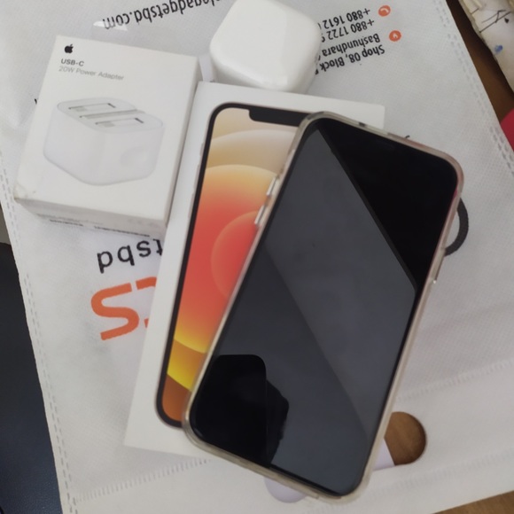 This is iPhone 12 which is 128gb and the colour is white.comes with box,charger. - Picture 2 of 5